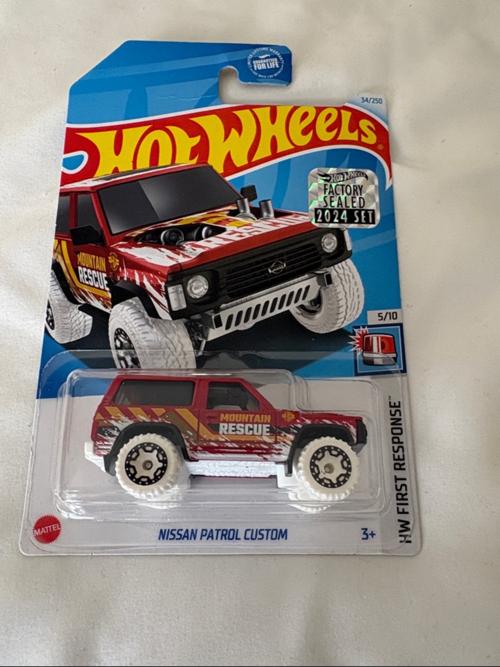 Factory sealed set. Nissan Patrol Custom - Mountain Rescue Red Toy Vehicle